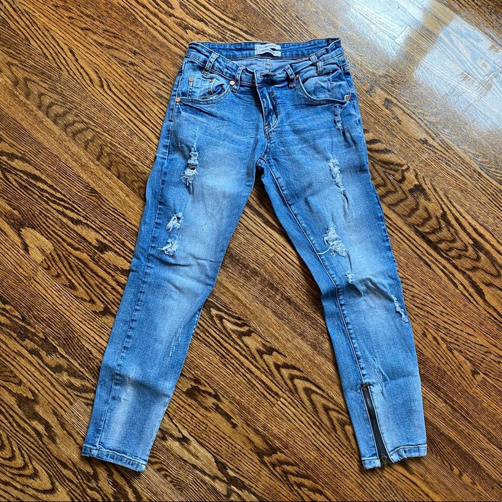 Distressed blue jeans